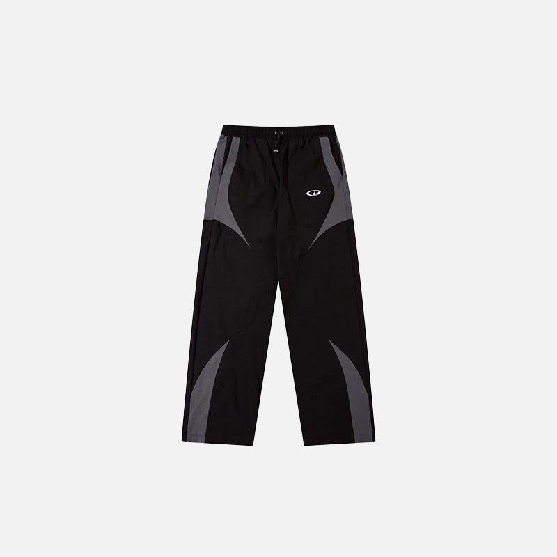 Front view of the black Vintage Black Patchwork Pants in a gray background