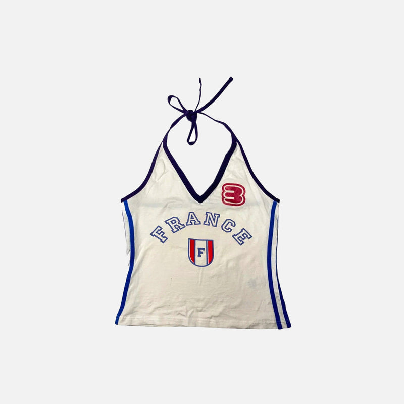 Front view of the beige Halter 90s Style France Top in a gray background