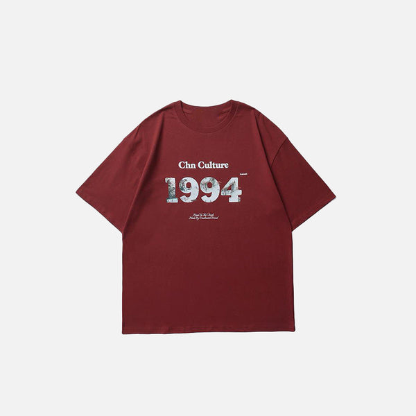 Front view of the red Y2k Loose Retro 1994 T-shirt in a gray background