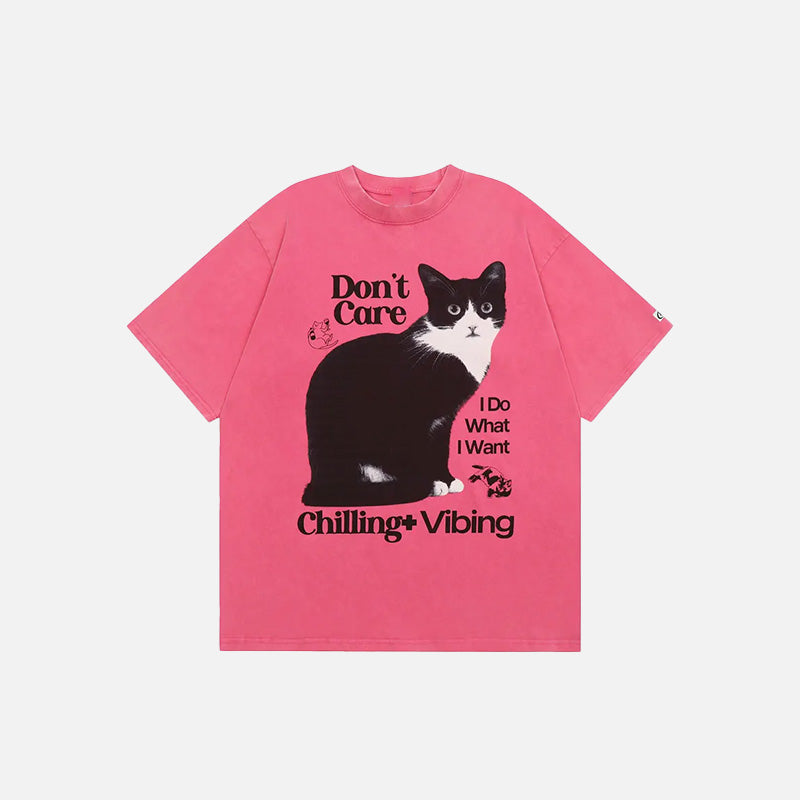 Front view of the pink Chilling Cat Graphic T-shirt in a gray background