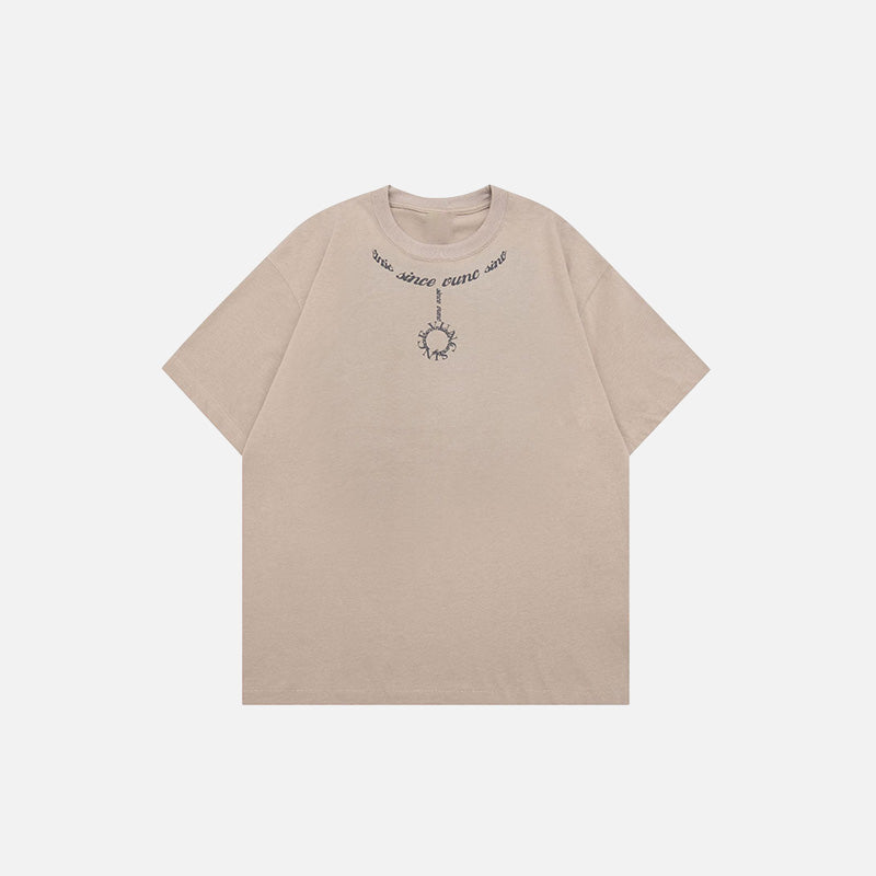 Front view of the camel Loose Chain Printed T-shirt in a gray background