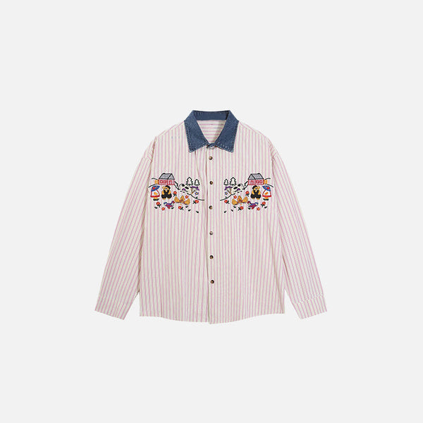 Front view of the pink Embroidered Village Scene Shirt in a gray background