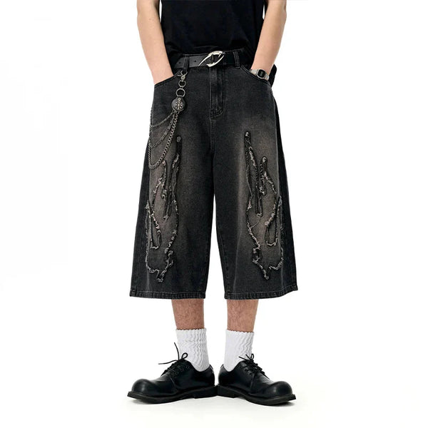Model wearing the black Edgy Chain Denim Shorts