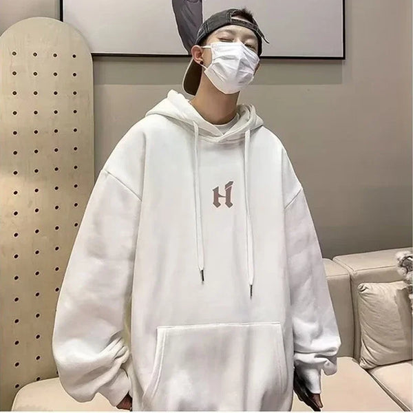 Model wearing the white Baggy Logo Hoodie