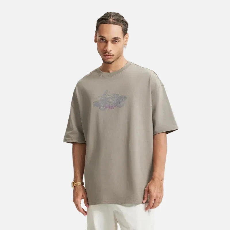 Model wearing the gray Bold Graphic T-Shirt in a gray background