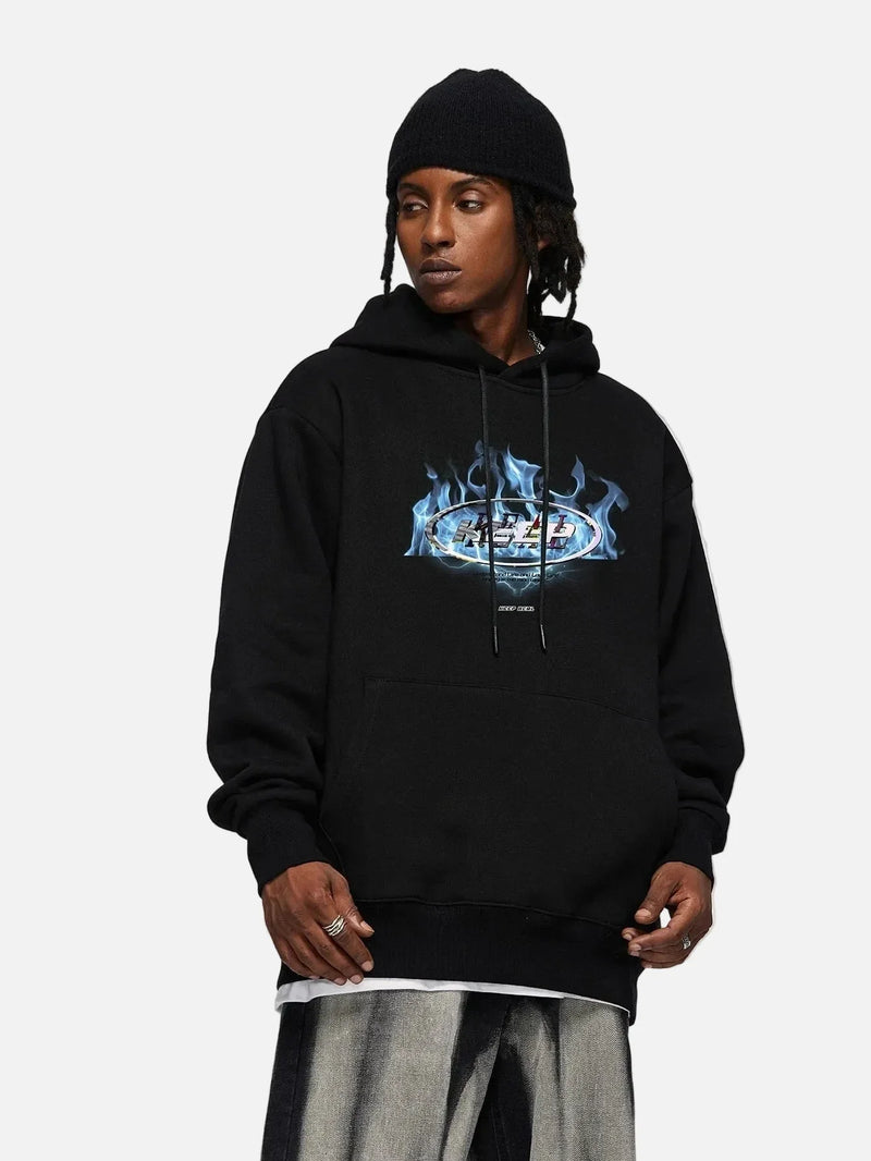 Model wearing the black Fire Wave Graphic Hoodie in a gray background
