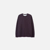 Front view of the purple Classic Crewneck Sweater in a gray background