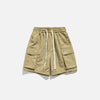 Front view of the khaki Essential Utility Cargo Shorts in a gray background