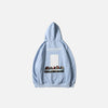 Back view of the blue Disintegration Art Hoodie in a gray background 