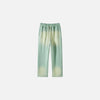 Front view of the light green Casual Noir Relax Pants in a gray background