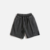 Front view of the black Vintage Washed Denim Shorts in a gray background