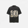 Front view of the black Vintage Grunge Patch T-Shirt in a gray background
