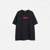 Front view of the black Patchwork Embroidered Eye T-Shirt in a gray background