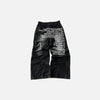 Front view of the black Whispered Denim Elegance Jeans in a gray background
