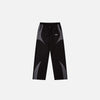 Front view of the black Vintage Black Patchwork Pants in a gray background