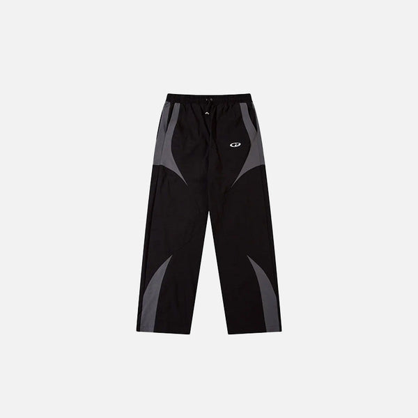 Front view of the black Vintage Black Patchwork Pants in a gray background
