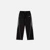Front view of the Y2K Black Patchwork Sports Pants in a gray background 