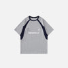 Front view of the gray Loose Racing Patchwork T-shirt in a gray background