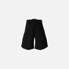 Front view of the black Irregular Blade Niche Suit Jorts in a gray background 