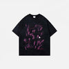 Front view of the black Graphic Printed Grunge T-Shirt in a gray background