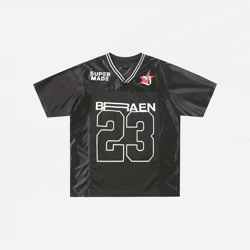 Front view of the black Patchwork Graphic Printed T-Shirt n a gray background
