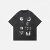 Front view of the black Black Graphic Eyes T-shirt in a gray background