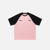 Front view of the pink Raglan Sleeve Contrast Color T-shirt in a gray background 