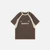 Front view of the brown Loose Racing Patchwork T-shirt in a gray background