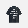 Front view of the black Loose Printed T-shirt in a gray background