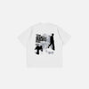 Front view of the white Dream Chaser Graphic T-shirt in a gray background