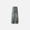 Front view of the blue Floral Fantasy Jeans in a gray background