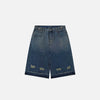 Front view of the blue Y2k Ripped Washed Jorts in a gray background