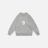 Front view of the grey Number 9 Embroidered Sweatshirt in a gray background