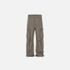 Front view of the brown Loose Washed Pleated Jeans in a gray background