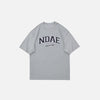 Front view of the gray Oversized Loose T-Shirt in a gray background 