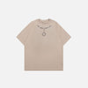 Front view of the camel Loose Chain Printed T-shirt in a gray background 