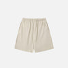 Front view of the beige Letter Print Loose Shorts in a gray background 