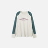 Front View of the beige Aero Wave T-shirt in a gray background