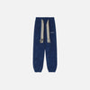 Front view of the blue Urban Nomad Jogger Pants in a gray background