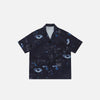 Front view of the black Y2K Eye Print Loose Shirt in a gray background 