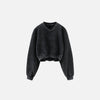 Front view of the black Women's Fleece Cropped Sweatshirt in a gray background 