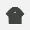 Front view of the grey Sleek Mono Logo T-shirt in a gray background