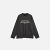 Front view of the dark gray Motivational Long-Sleeve T-shirt in a gray background