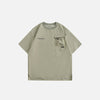 Front view of the green Vintage Loose Pocket T-shirt in a gray background