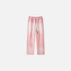 Front view of the pink Casual Noir Relax Pants in a gray background