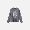 Front view of the dark gray 2024 Victory Emblem T-shirt in a gray background