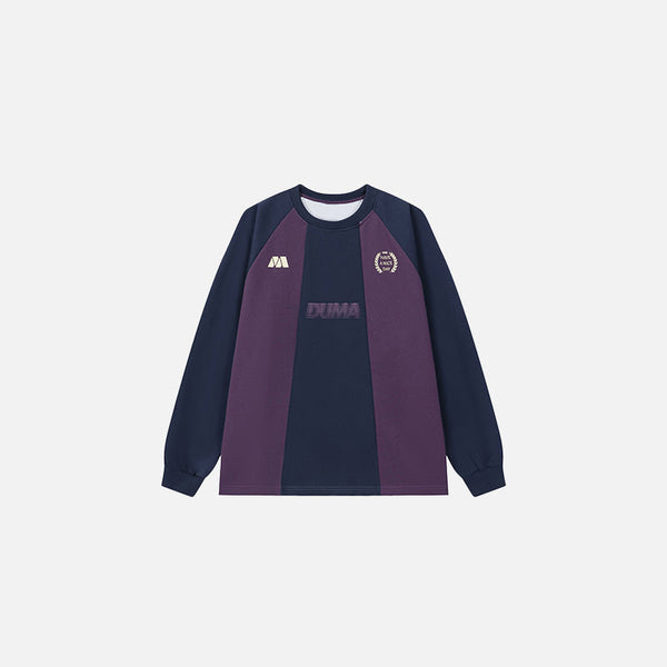 Front view of the purple Elite Crest Long Sleeve T-shirt in a gray background