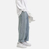 White long-sleeve shirt, wide light blue jeans, white Nike shoes, white background.