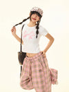 Model wearing the white Y2k Woman's Bow Printed T-shirt