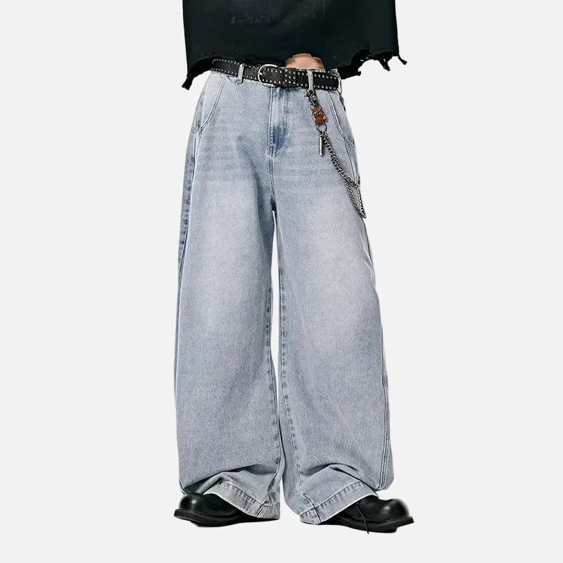 Model wearing the light blue Vintage Wid-Leg Denim Jeans in a gray background